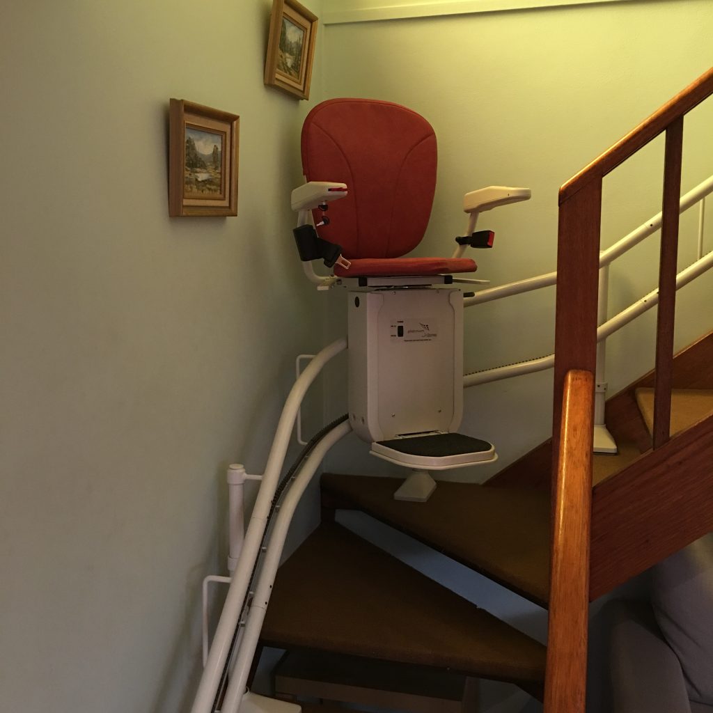 Curve stairlift with red seat