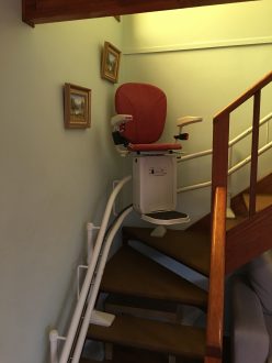 Curve stairlift with red seat